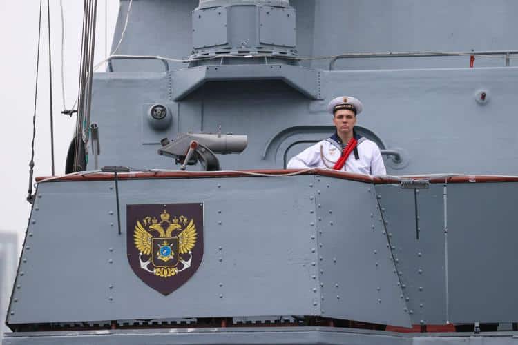 a man in a uniform on a boat
