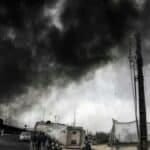 Teheran tra fumo nero e pioggia acida