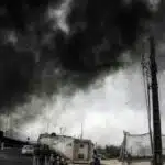 Teheran tra fumo nero e pioggia acida