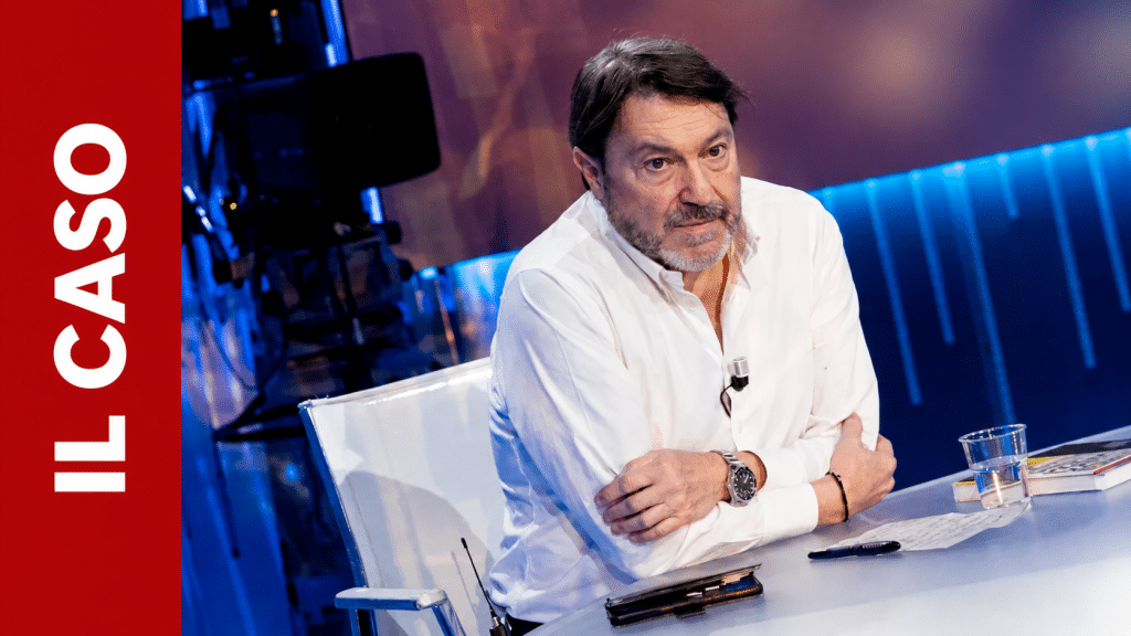 Uomo serio in studio televisivo.